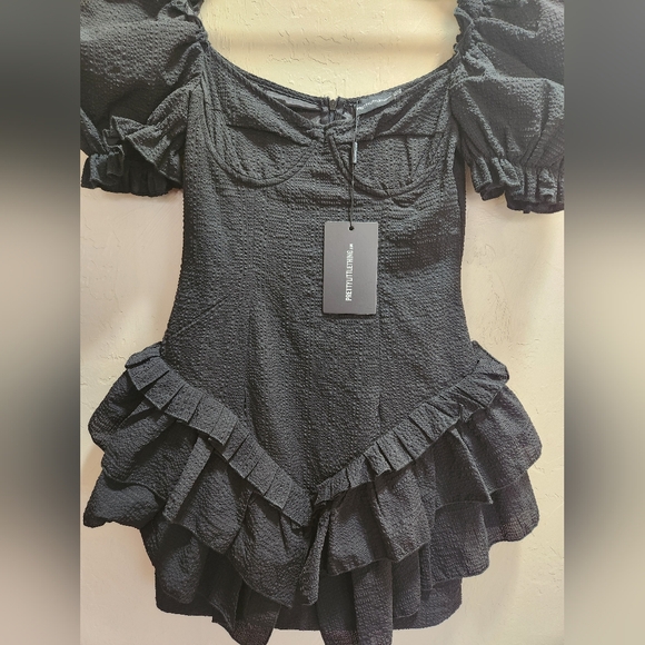 Pretty Little Thing Black Textured Puff Sleeve Frill Skirt Bodycon Dress - Picture 5 of 9